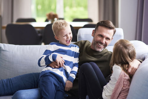 Father with his children learning about how to save money online